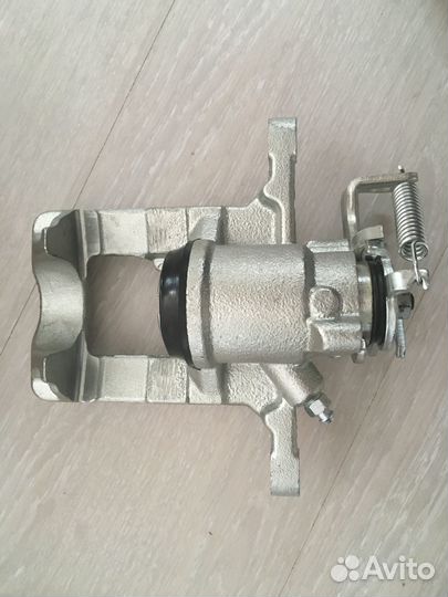 Суппорт тормозной задний левый opel astra J