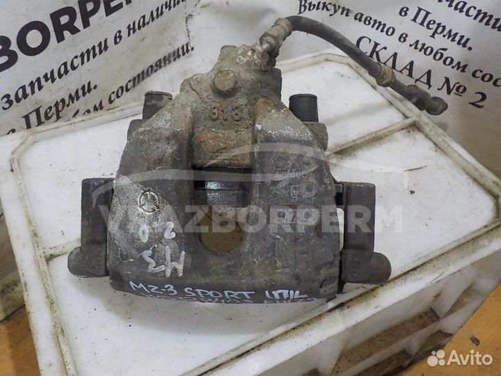 Суппорт тормозной передний левый Mazda 3
