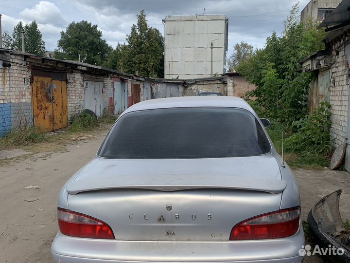 Стекло заднее Kia Clarus