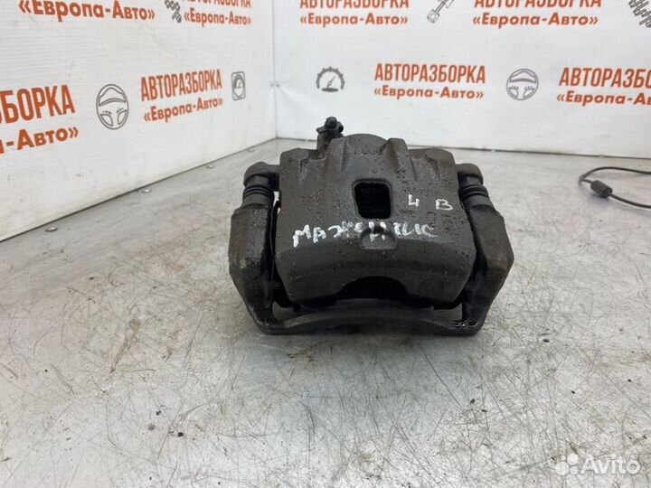 Суппорт тормозной передний левый Kia Magentis 2