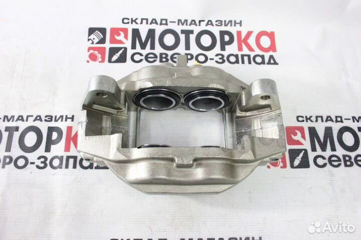 Суппорт тормозной передний левый Toyota Land