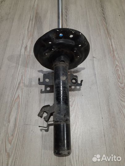 Амортизатор стойка перед Nissan X-trail T32 Лев