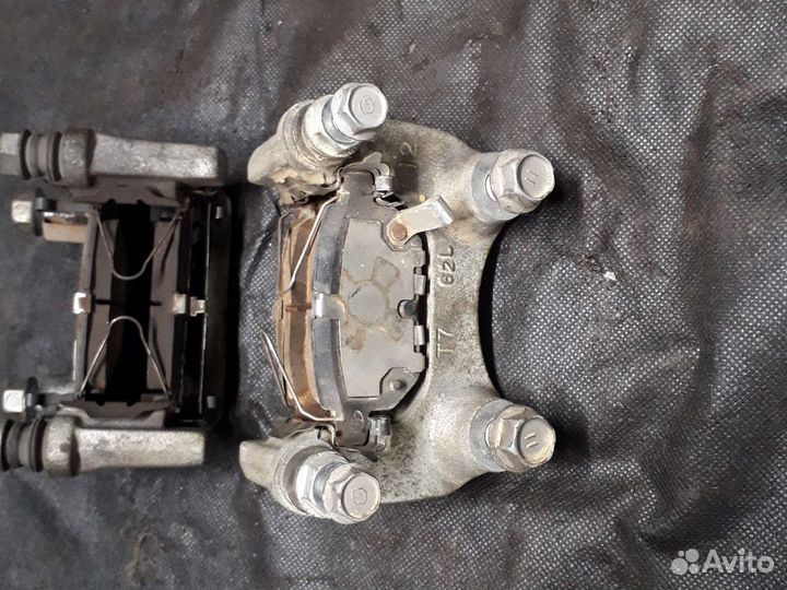 Скоба суппорта заднего Toyota Corolla E210