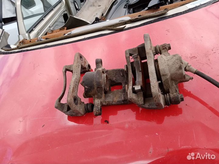 Суппорт передний левый KIA spectra