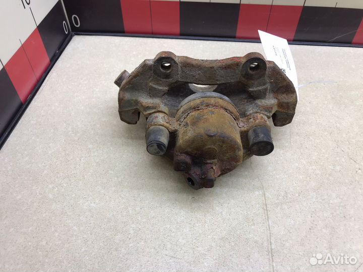 Суппорт передний правый Мазда 3 вк