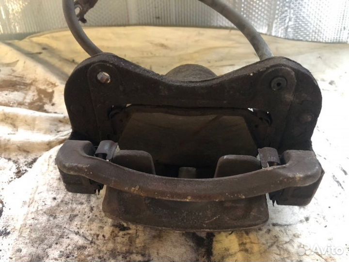 Суппорт тормозной передний левый Kia Sportage 3