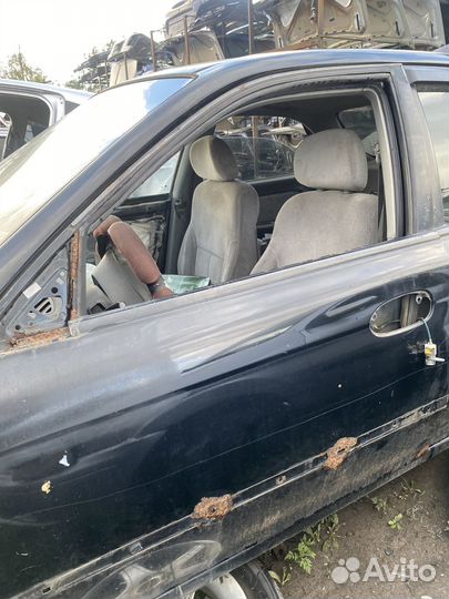 Передняя левая дверь Kia Spectra