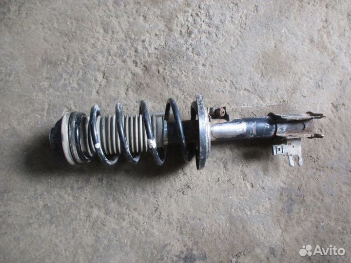 Амортизатор передний левый Opel Astra H / Family 2