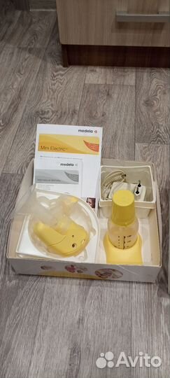 Молокоотсос medela электрический