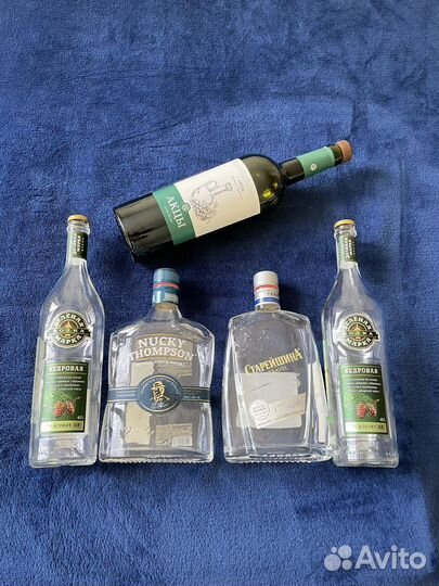 Бутылки с крышками от виски, коньяка, водки, вина