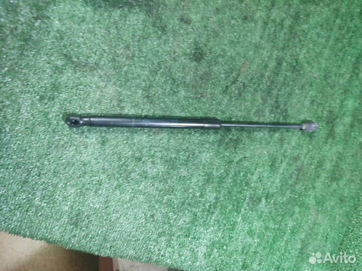 Амортизатор двери багажника Opel Astra H