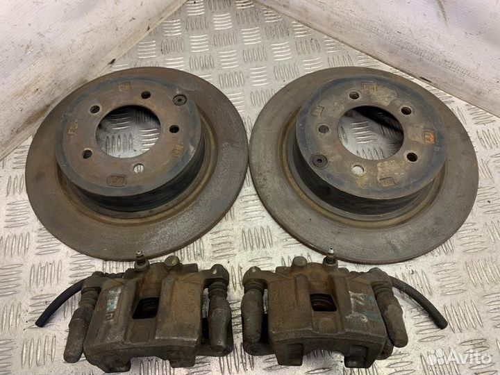 Суппорт тормозной задний Mitsubishi Lancer 10 4B11