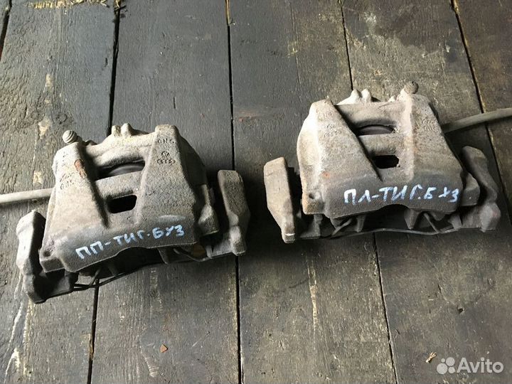 Суппорт тормозной передний левый правый Тигуан 1