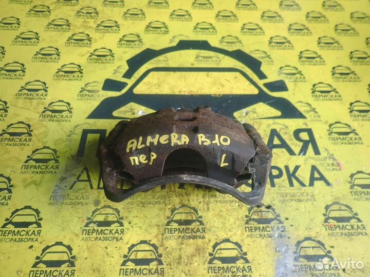 Суппорт тормозной передний левый Nissan Almera G15