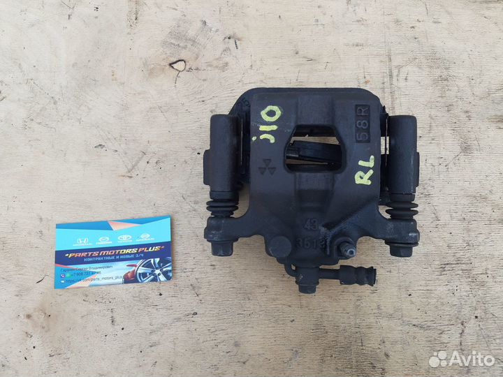 Суппорт тормозной задний левый Nissan Qashqai J10