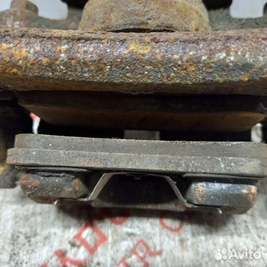 Суппорт тормозной задний левый Mitsubishi