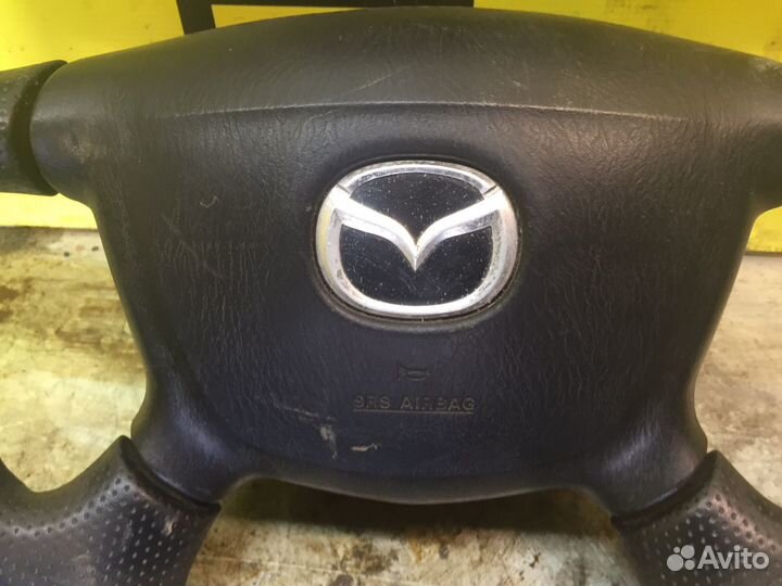 Руль mazda familia
