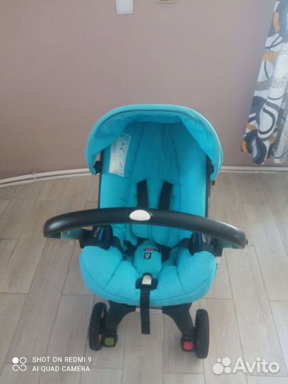 Коляска автокресло doona с базой isofix