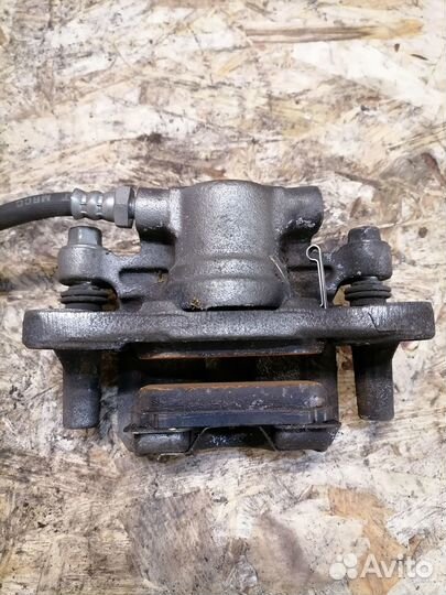 Суппорт задний правый Mitsubishi Lancer X