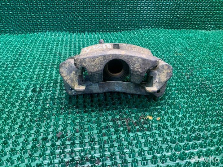 Суппорт тормозной левый Toyota Vista SV35 3SFE