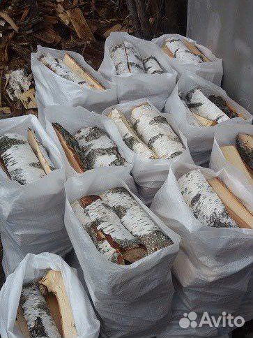 Дрова колотые в мешках