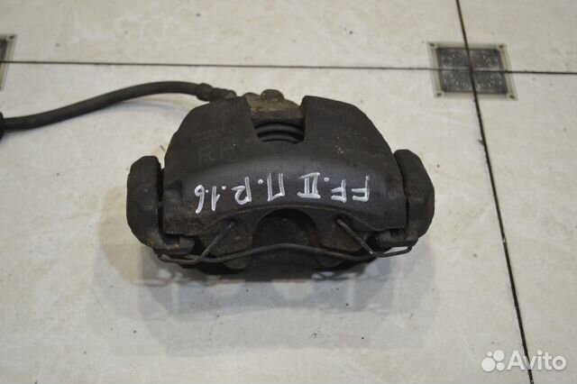 Тормозной суппорт передний правый Ford Focus 2