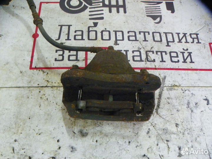 Суппорт тормозной передний левый Hyundai Tucson