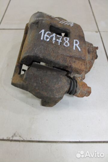 Суппорт тормозной Киа Спектра