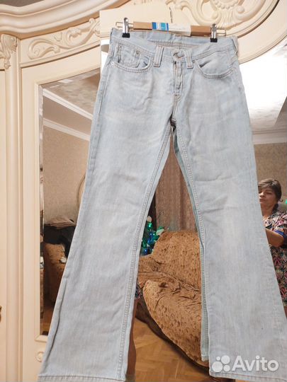Джинсы клеш женские