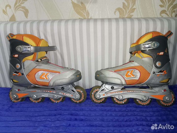 Роликовые коньки