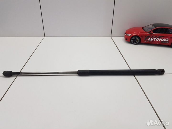 Амортизатор багажника левый (Mazda 3)