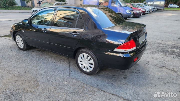 Mitsubishi Lancer 1.6 МТ, 2009, 194 200 км