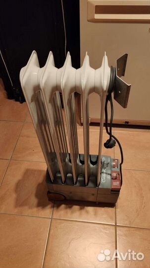 Масляный обогреватель delonghi