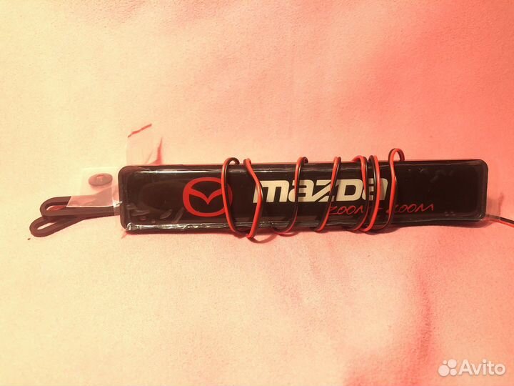 Эмблема mazda zoom zoom