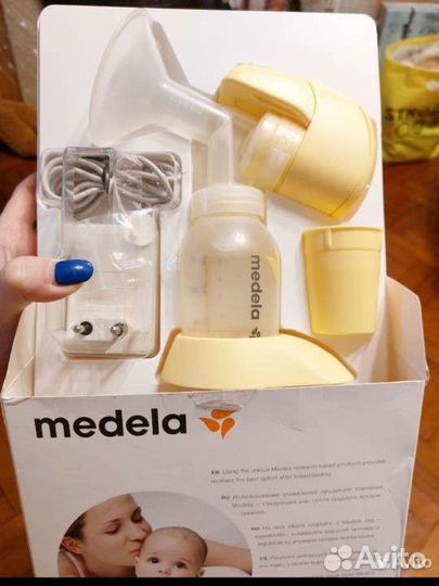 Молокоотсос medela электрический
