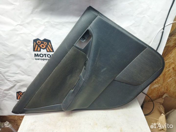 Обшивка двери задняя левая Toyota Corolla E12 1.6