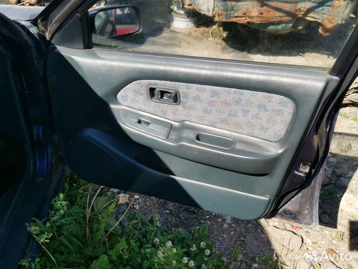 Обшивка двери ниссан альмера н15