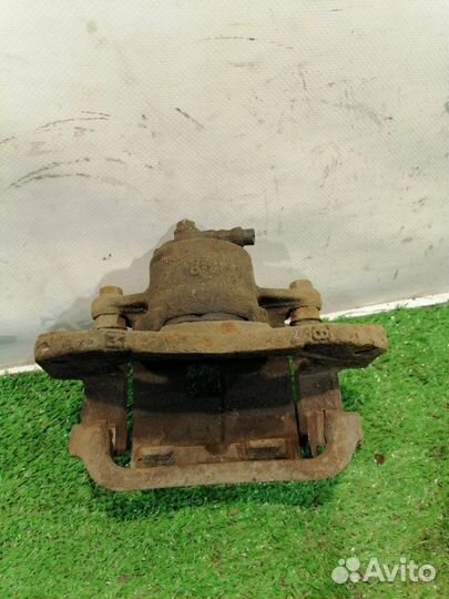 Суппорт тормозной передний правый Mazda 323 6 (BJ)