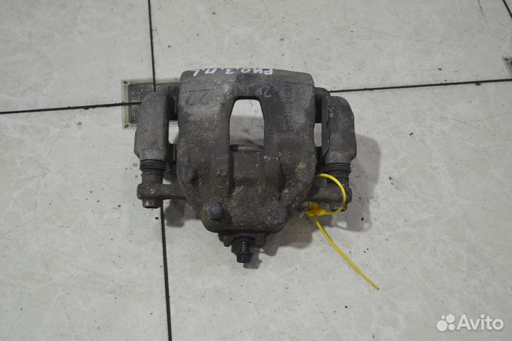 Тормозной суппорт передний левый Kia Rio 3