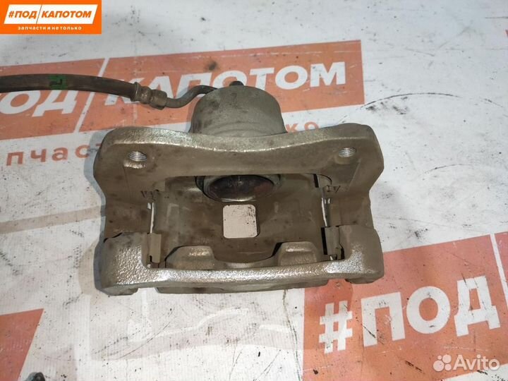 Суппорт тормозной передний левый Kia Sportage 4