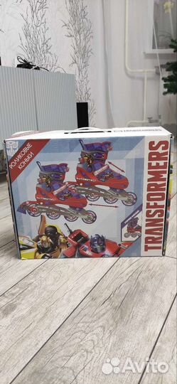 Роликовые коньки