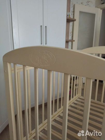 Детская кроватка с продольным маятником
