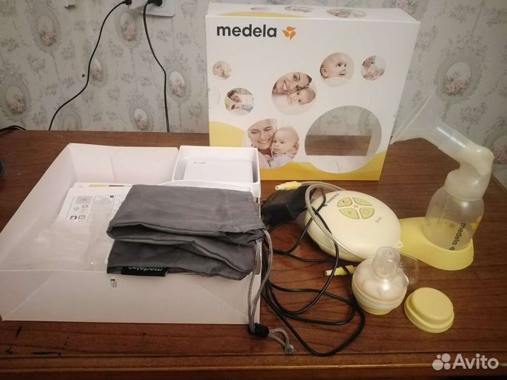 Молокоотсос medela электрический