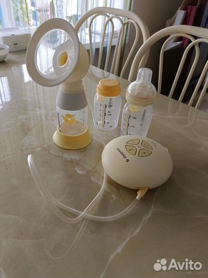 Молокоотсос medela электрический