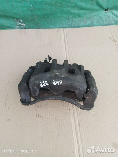 Суппорт тормозной передний правый Kyron 2009 г