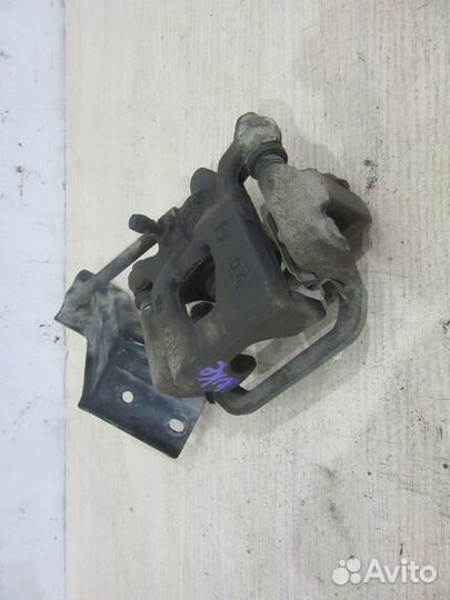 Суппорт тормозной задний левый Nissan Juke