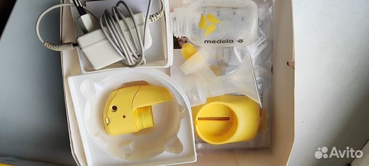 Молокоотсос medela электрический