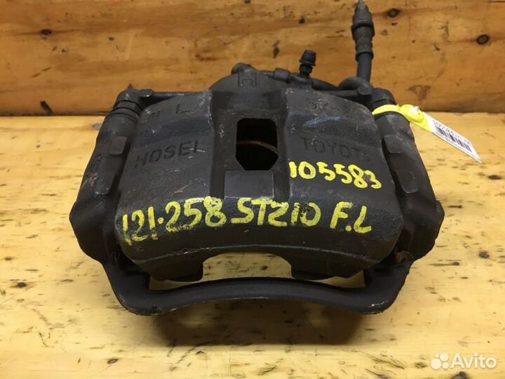 Суппорт передний левый Toyota Corona Premio ST210