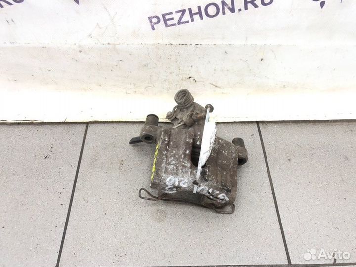 Суппорт тормозной задний левый Ford Focus хэтчбек