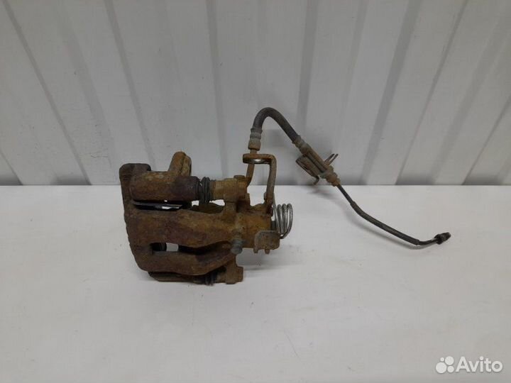 Суппорт тормозной задний левый Kia Rio QB 1.6 G4FC